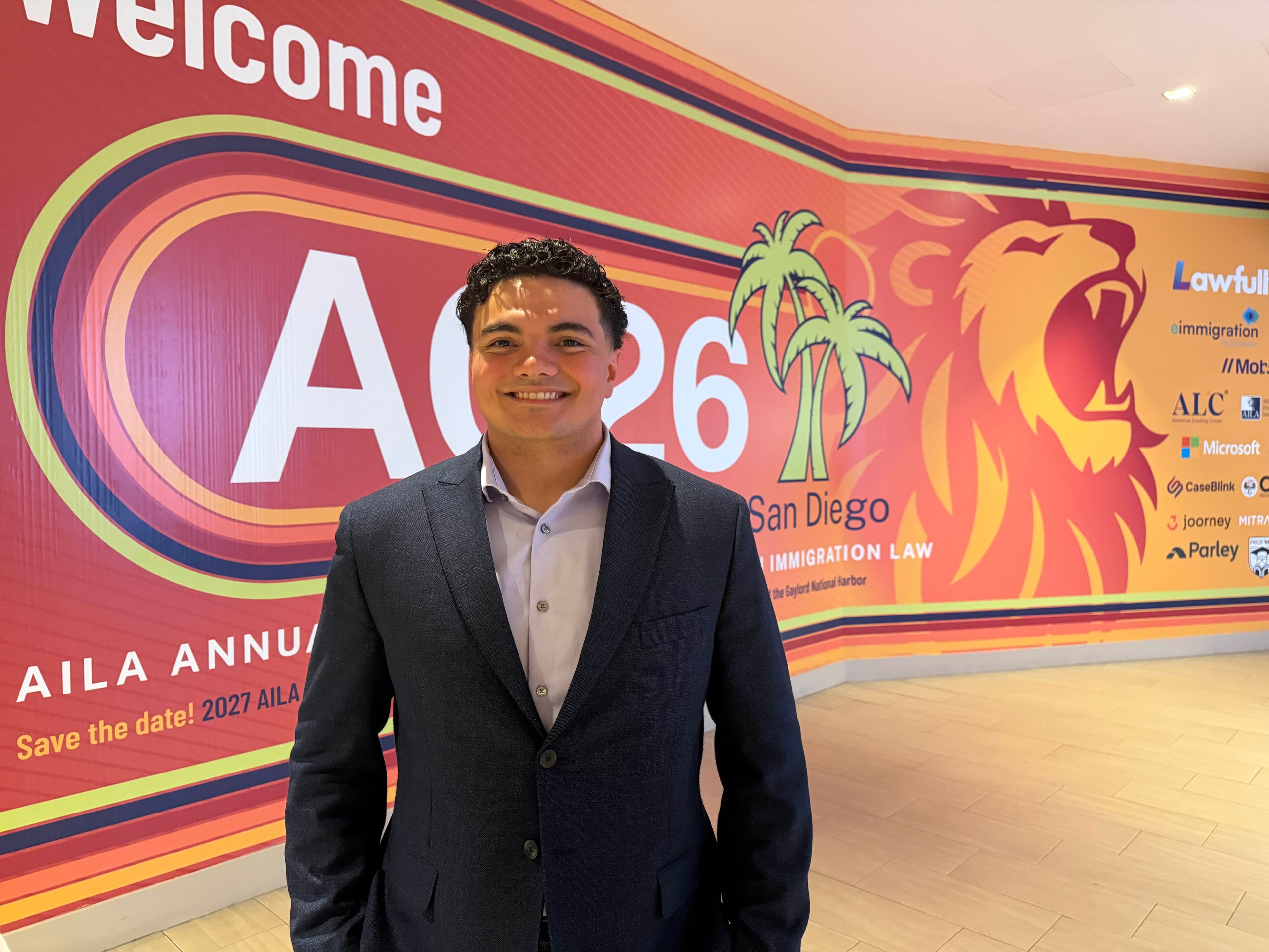 Devin McCaw in a navy blazer at the AILA annual immigration-law conference